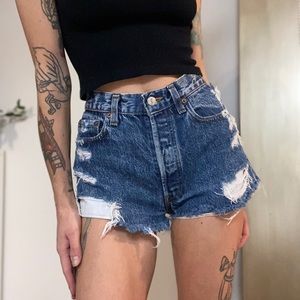Vintage distressed Levi’s denim shorts